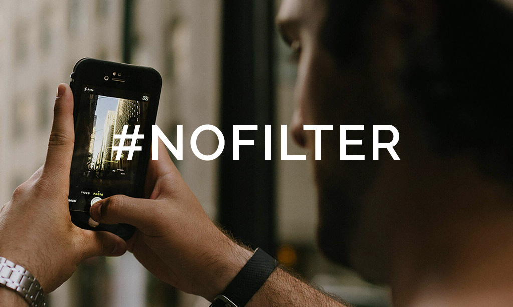 Person taking picture on phone with text overlay of #nofilter